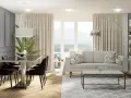 Nowoczesny salon z jadalnią, gdzie duże okno w salonie aranżacje tworzą jasną przestrzeń. Jasna sofa, stolik kawowy i elegancki stół z krzesłami.