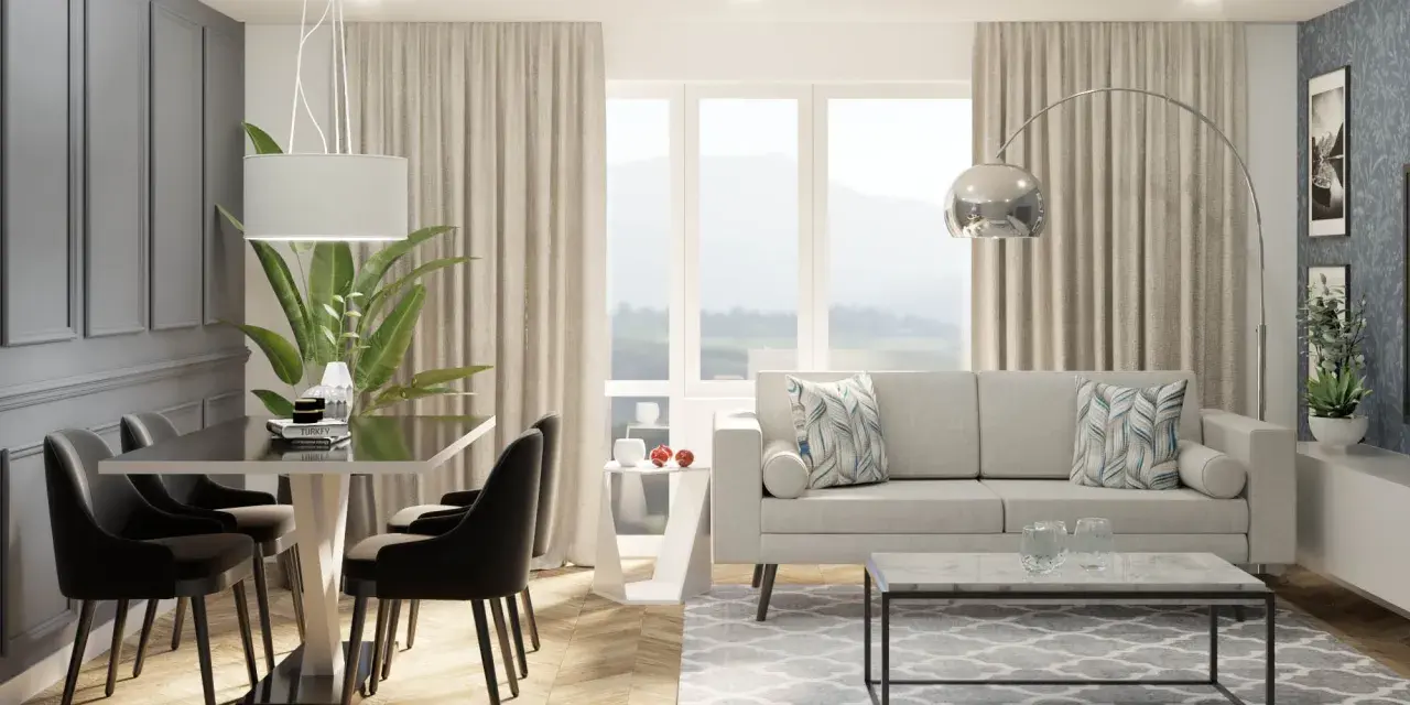 Nowoczesny salon z jadalnią, gdzie duże okno w salonie aranżacje tworzą jasną przestrzeń. Jasna sofa, stolik kawowy i elegancki stół z krzesłami.