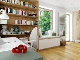 Przytulna biblioteczka w salonie z pluszakami, książkami i wygodnym miejscem do siedzenia przy oknie.
