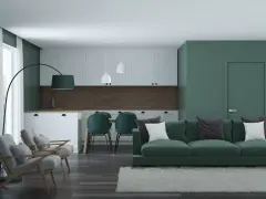 Nowoczesny salon z kuchnią w odcieniach zieleni. Kolor zielony znaczenie spokoju i harmonii, podkreślony przez meble i ściany.