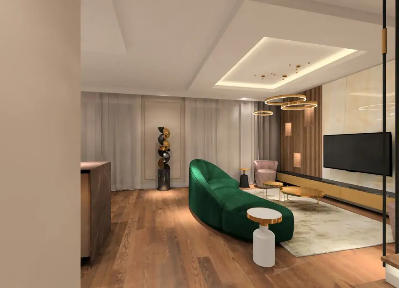 Nowoczesny salon z sofą w kształcie fali w głębokim, oliwkowym kolorze ścian. Drewniana podłoga i złote akcenty dodają elegancji.