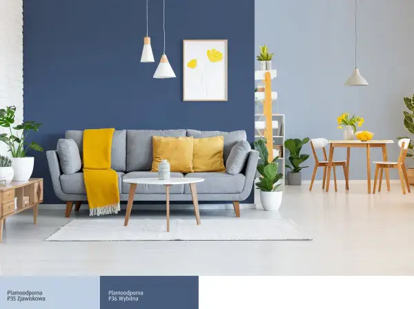 Nowoczesny salon z sofą i stolikiem kawowym. Ściana podzielona na dwa odcienie niebieskiego, nazwy P35 Zjawiskowa i P36 Wybitna.